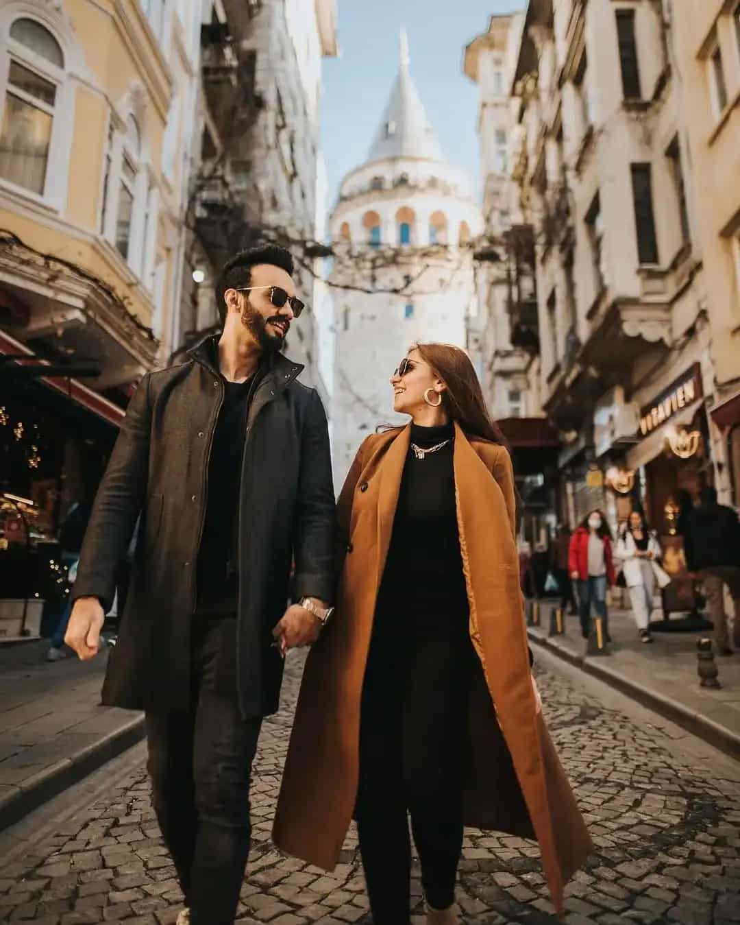 Istanbul couple photography session romantic poses historic Galata Tower professional photographer
